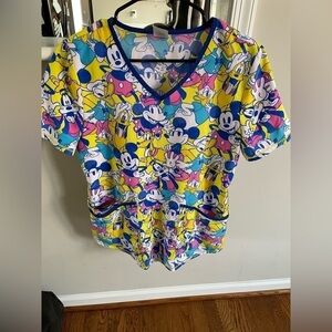 Disney . Disney Scrubs top, v- neck size S with Mickey, Daisy , Pluto and Goofy